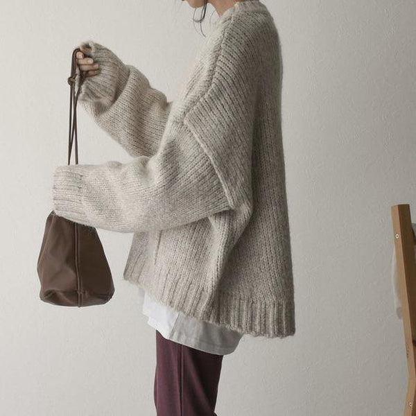 Noëlle | Oversized ivoorwitte trui met frontzak