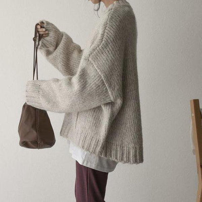 Noëlle | Oversized ivoorwitte trui met frontzak