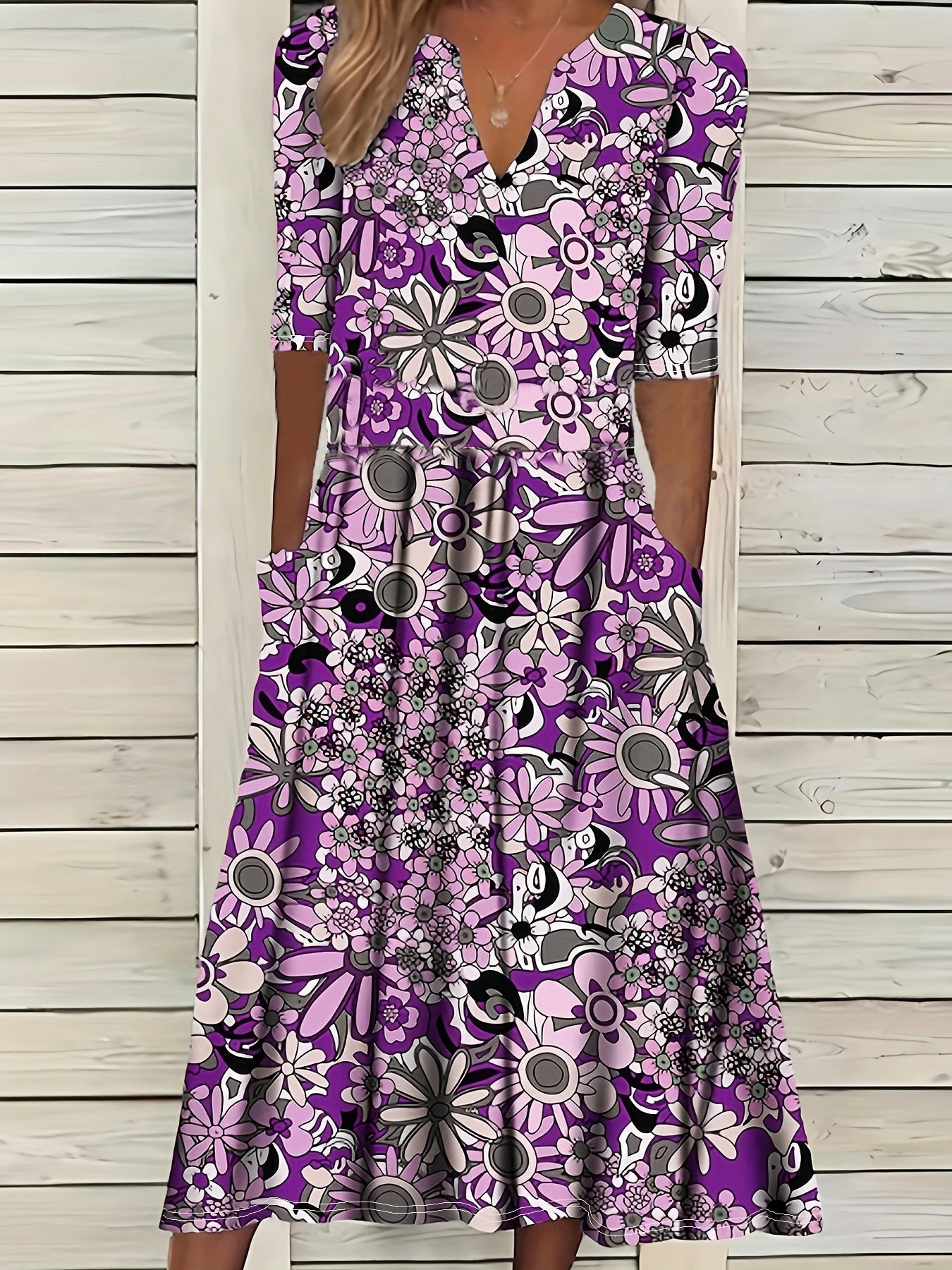 Odette | Midi-jurk met bloemenprint, V-hals en asymmetrische zoom
