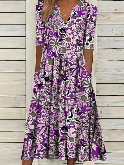 Odette | Midi-jurk met bloemenprint, V-hals en asymmetrische zoom