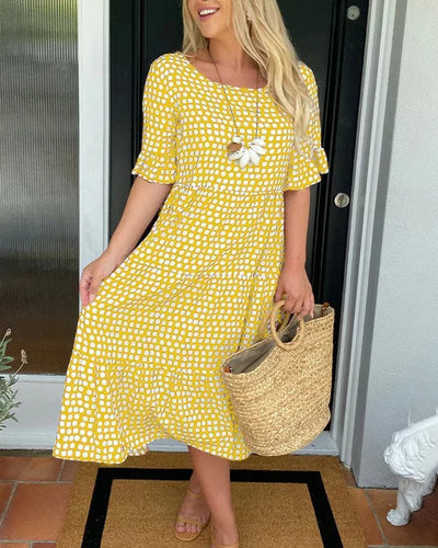 Isaline | Midi-jurk met ruches en speelse stippenprint