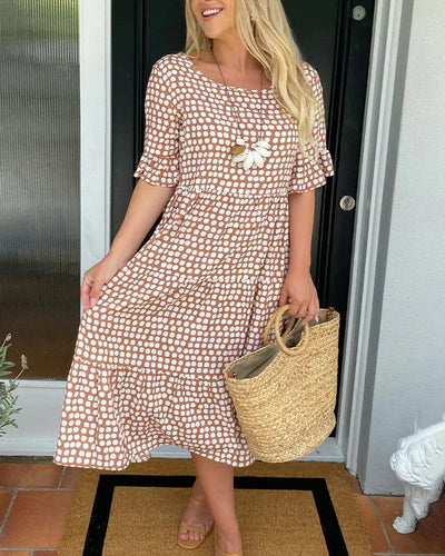 Isaline | Midi-jurk met ruches en speelse stippenprint