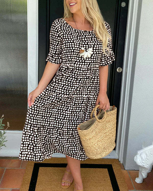 Isaline | Midi-jurk met ruches en speelse stippenprint