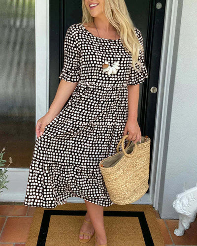 Isaline | Midi-jurk met ruches en speelse stippenprint