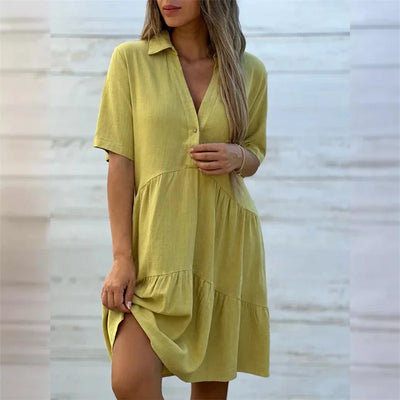 Céline | Zomerse A-lijn jurk met knoopdetail en soepele plooien
