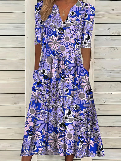 Odette | Midi-jurk met bloemenprint, V-hals en asymmetrische zoom