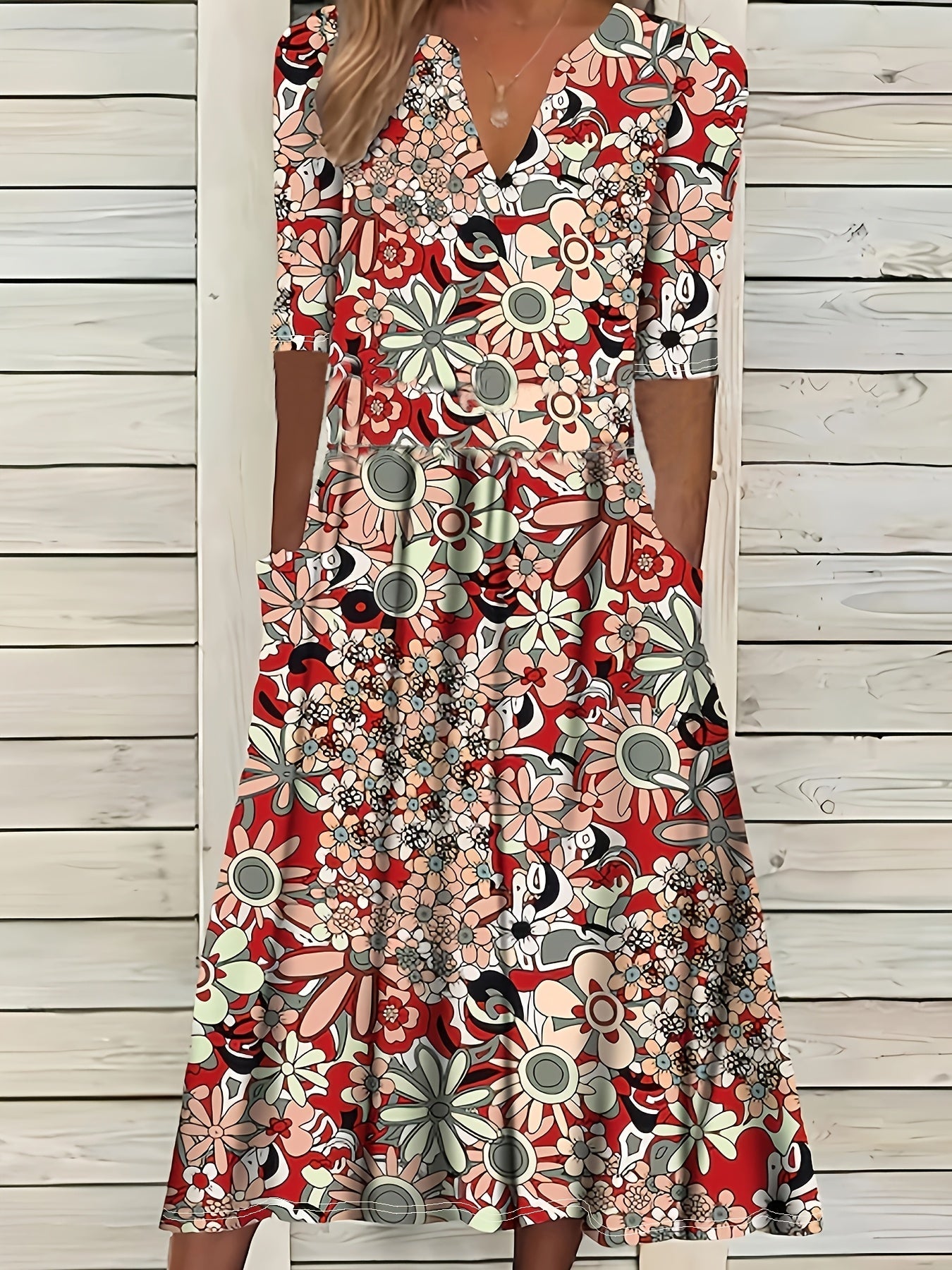 Odette | Midi-jurk met bloemenprint, V-hals en asymmetrische zoom