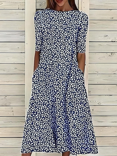 Céleste | Midi-zomerjurk met kustbloemen en ronde hals